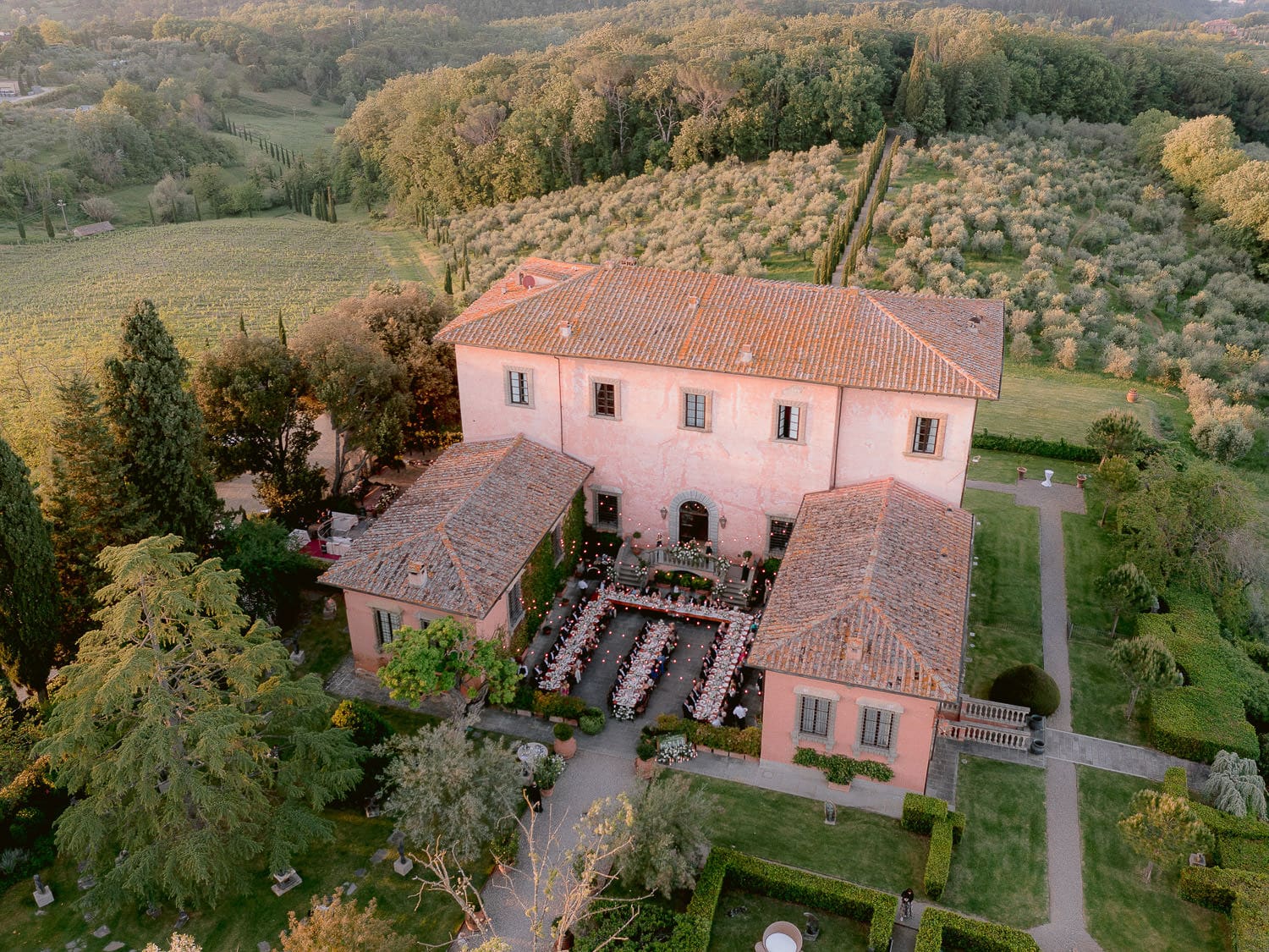 a wedding reception in the courtyard of Villa Mangiacane with the tuscan countryside all around