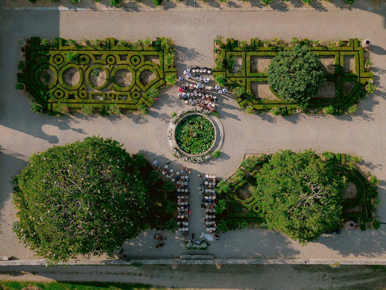 a moment from a ceremony in the precious gardens of Villa Corsini