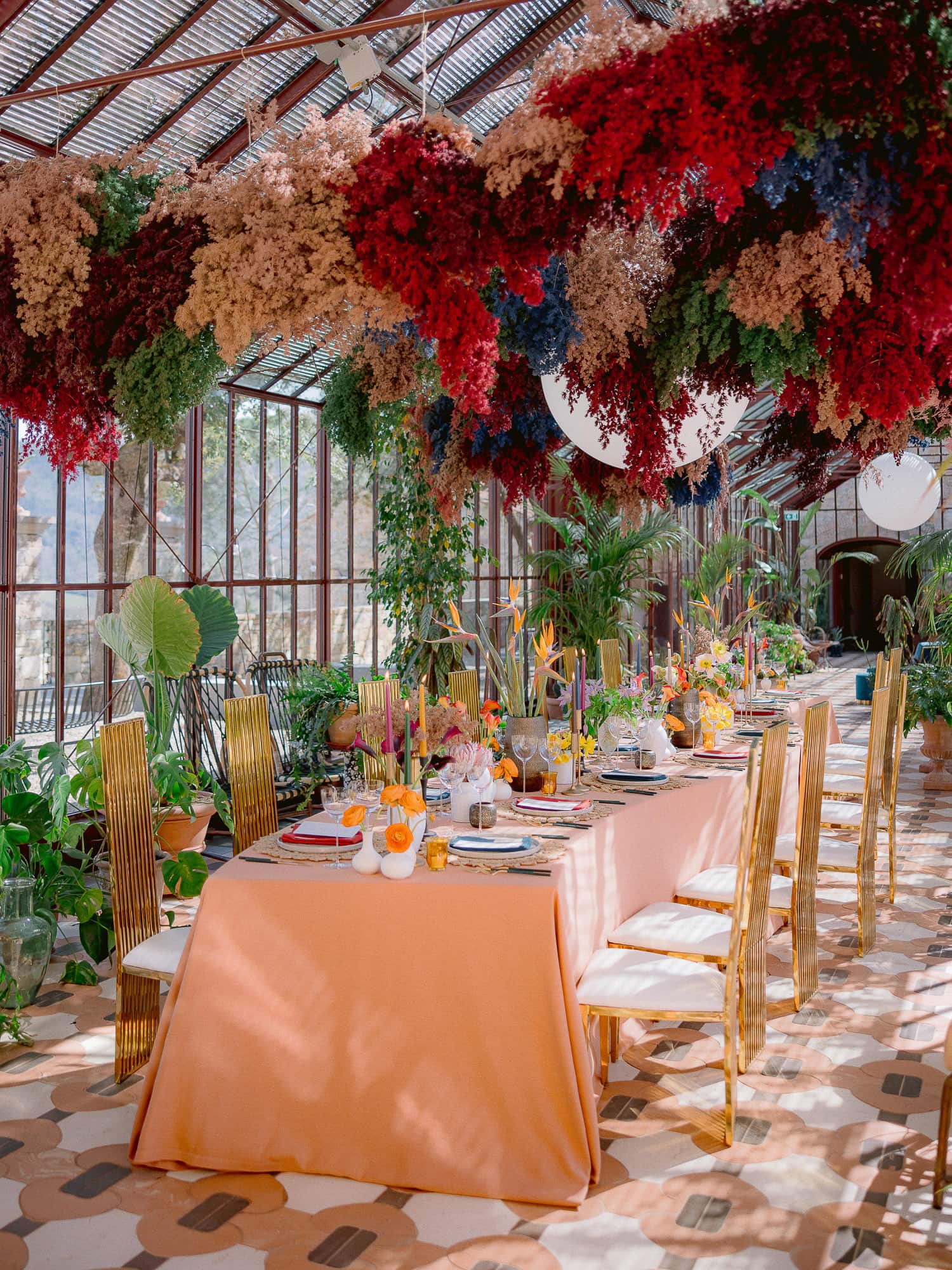 a colorful table setting in the winter garden of Vignamaggio
